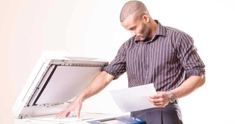 Teacher using photocopier