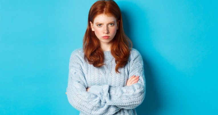 Photograph of angry-looking teenage girl
