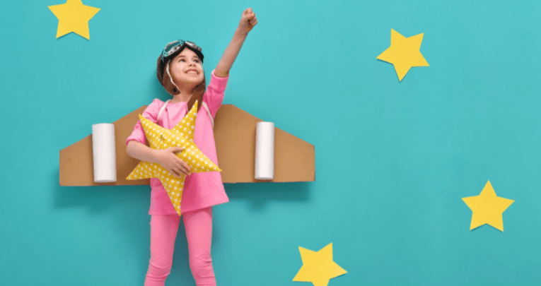 Girl in astronaut costume representing successful people