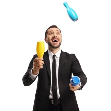 humorous photo of man in suit juggling with clubs