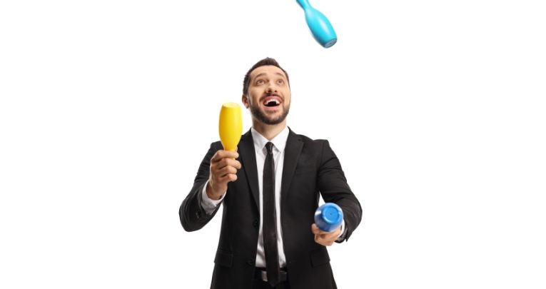 humorous photo of man in suit juggling with clubs