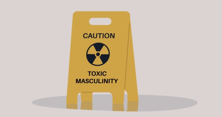 Mock-up illustration of a yellow wet floor warning sign that reads 'caution - toxic masculinity'