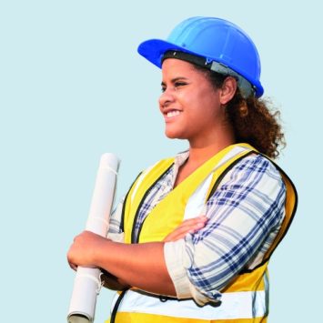 photo of a teenage girl wearing a high-vis vest and hard hat while holding a set of blueprints, representing women in STEM