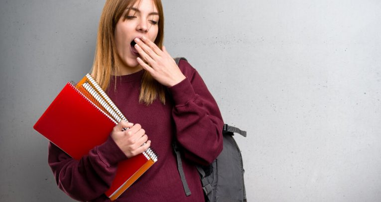 Girl yawning at thought of GCSE English Language revision