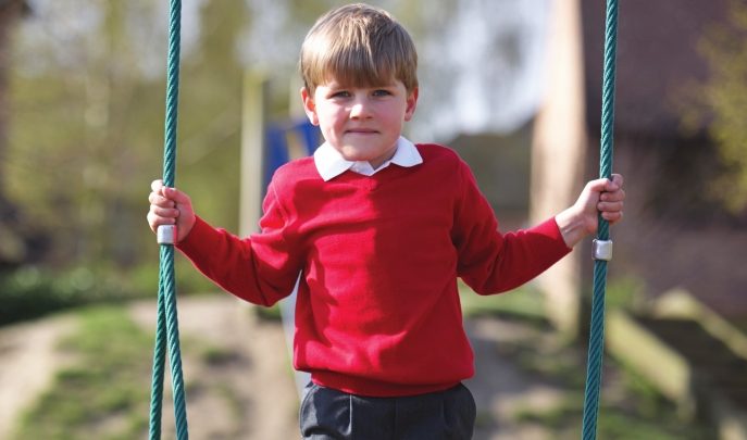 Pupil with SEND on swing, representing friendship activities