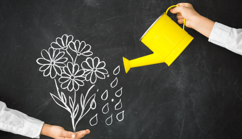 Blackboard illustration of flowers and watering can, representing fixed mindset and growth mindset