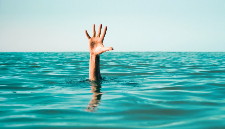 Waving hand in ocean, representing struggling early career teachers