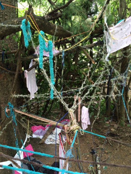 Strings wrapped around branches, representing Reggio Emilia approach in preschool