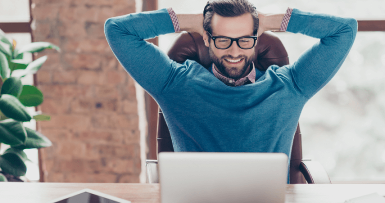 Happy teacher leaning back, representing overcoming teacher stress