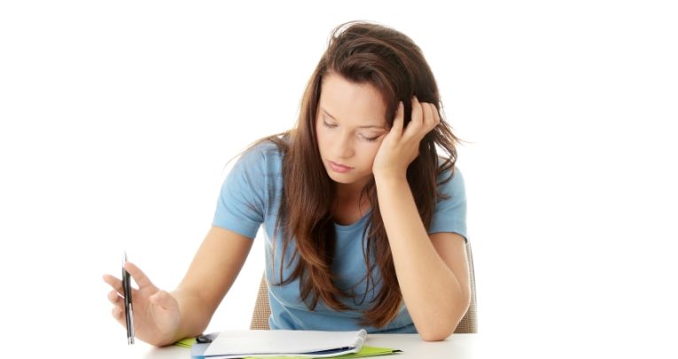 Photo of teenage girl studying, representing ongoing assessment