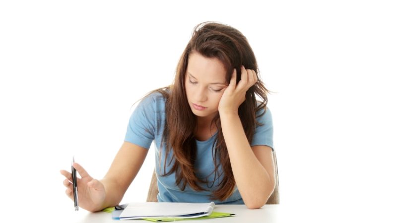 Photo of teenage girl studying, representing ongoing assessment