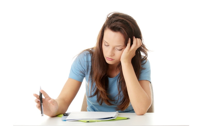 Photo of teenage girl studying, representing ongoing assessment