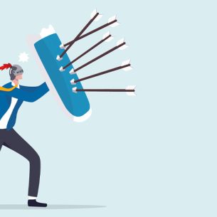 Cartoon illustration of figure holding up shield to protect himself from a volley of arrows, representing safeguarding in schools