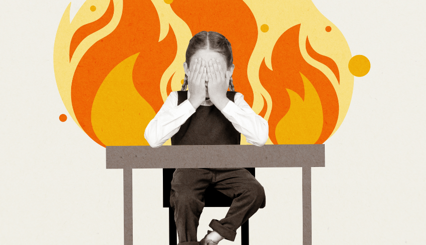 Child at desk with illustrated fire background representing behaviour management strategies for primary school