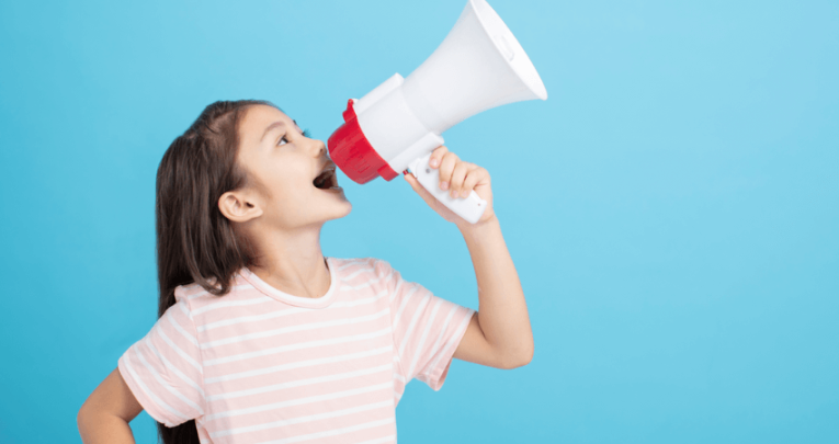 Girl shouting into megaphone, representing oracy
