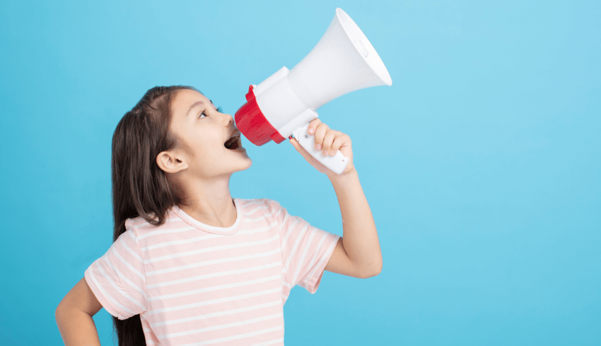 Girl shouting into megaphone, representing oracy