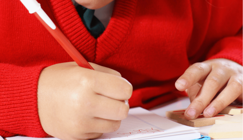 Schoolgirl writing sentence openers