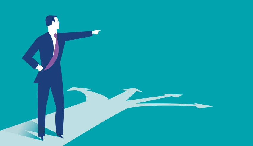 Abstract illustration of besuited figure choosing between four possible directions, representing curriculum development