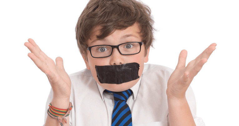 Schoolboy with tape over mouth, representing character description
