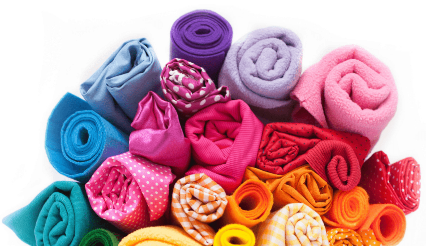 A bundle of brightly coloured textiles