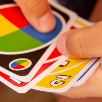 Close-up of a child playing a card game, representing starting the school day