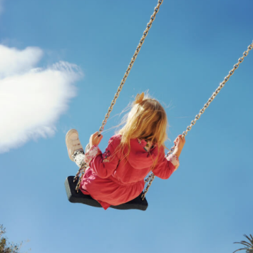 Girl on swing, representing neurodiverse children