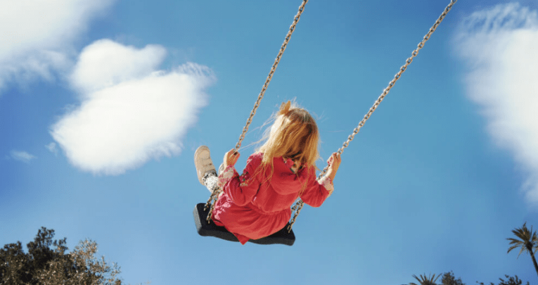 Girl on swing, representing neurodiverse children