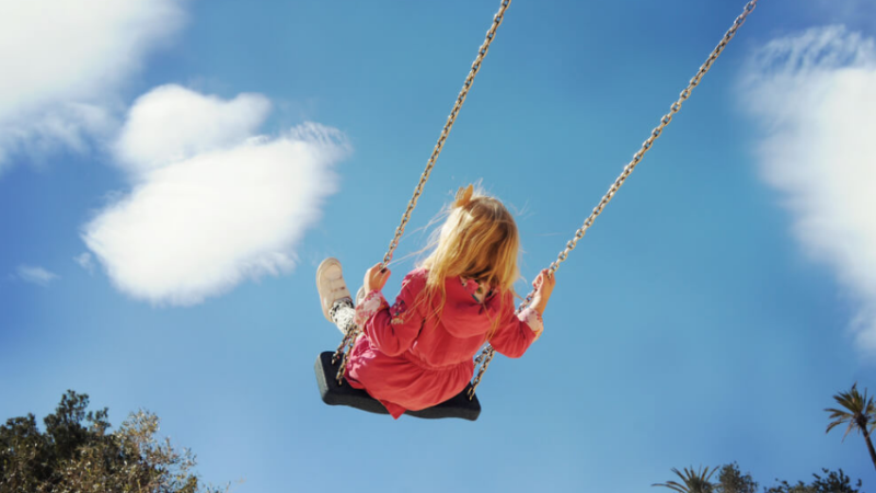 Girl on swing, representing neurodiverse children