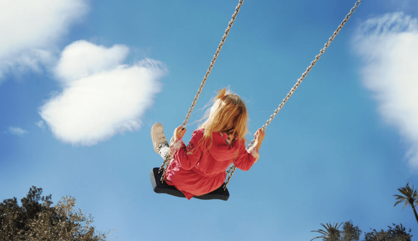 Girl on swing, representing neurodiverse children