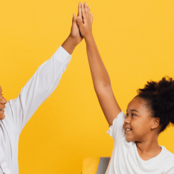 Talk partners high-fiving each other