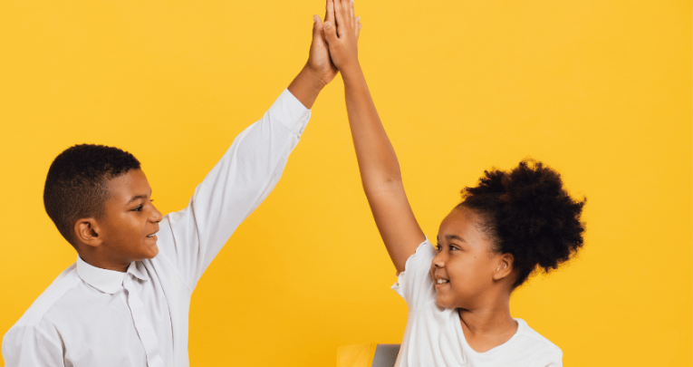 Talk partners high-fiving each other