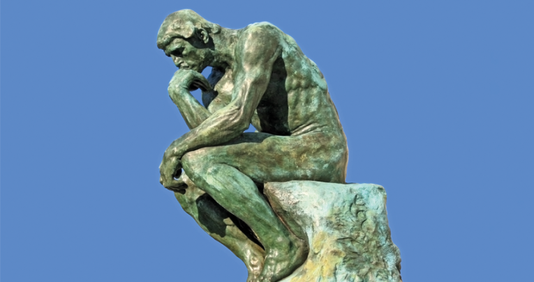 Photo of the bronze sculpture 'The Thinker', representing art history in schools