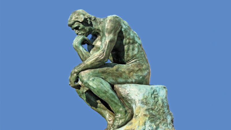 Photo of the bronze sculpture 'The Thinker', representing art history in schools