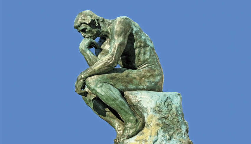 Photo of the bronze sculpture 'The Thinker', representing art history in schools