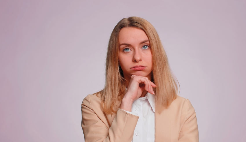Photo of tired-looking woman, representing teacher retention