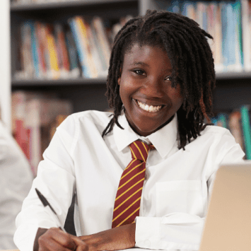 Girl at desk using knowledge organisers