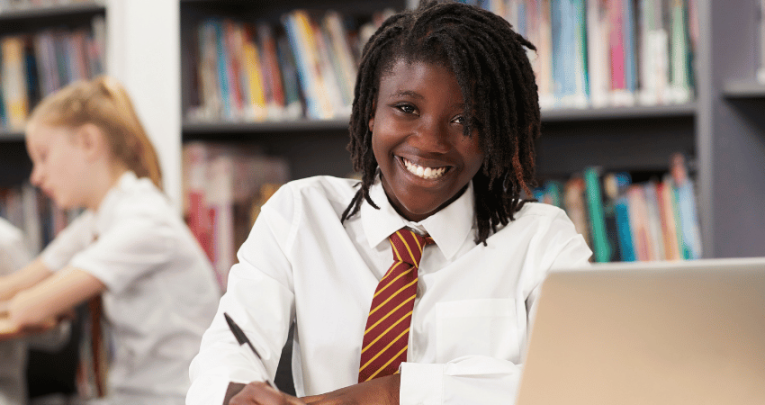 Girl at desk using knowledge organisers