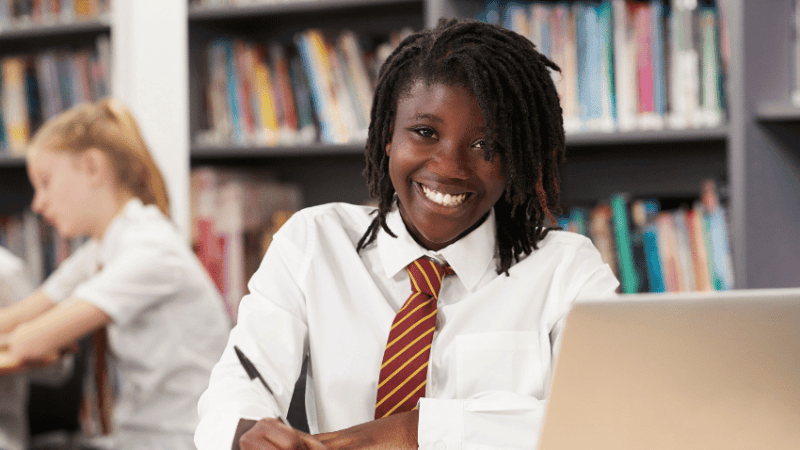 Girl at desk using knowledge organisers