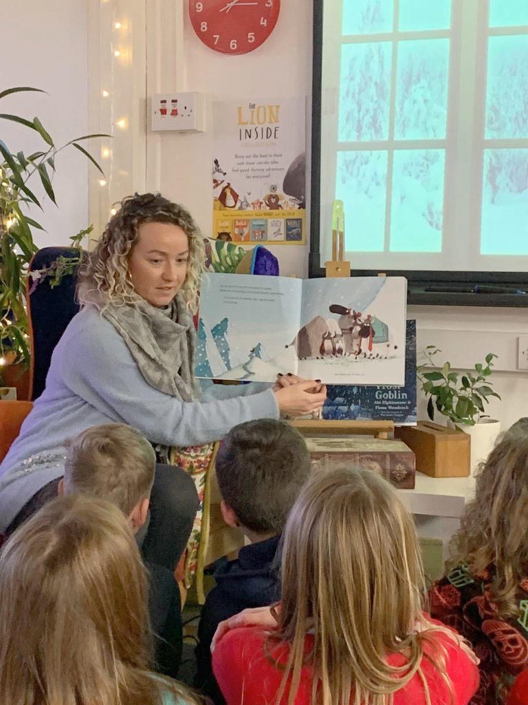 A woman reading to some children