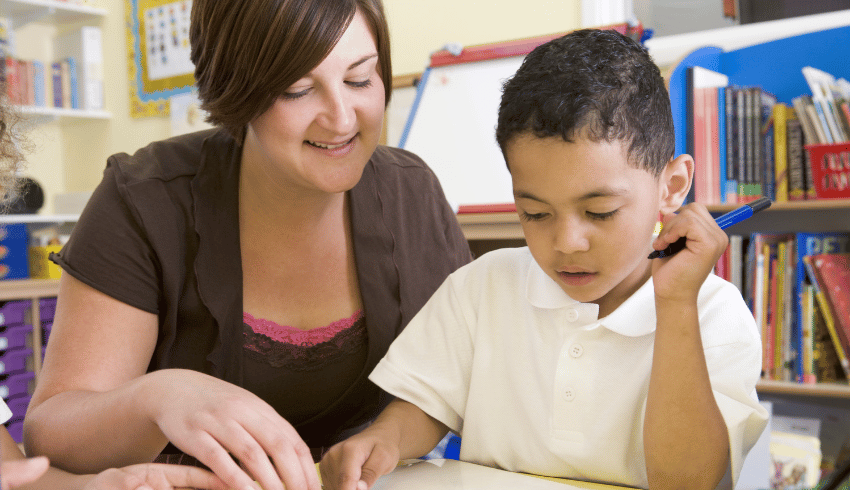 Teacher helping boy with ADHD