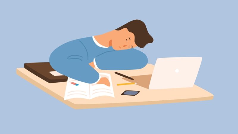 Cartoon illustration of a male student revising at home and trying not to fall asleep