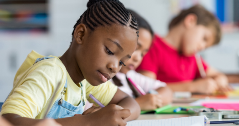 Three children writing