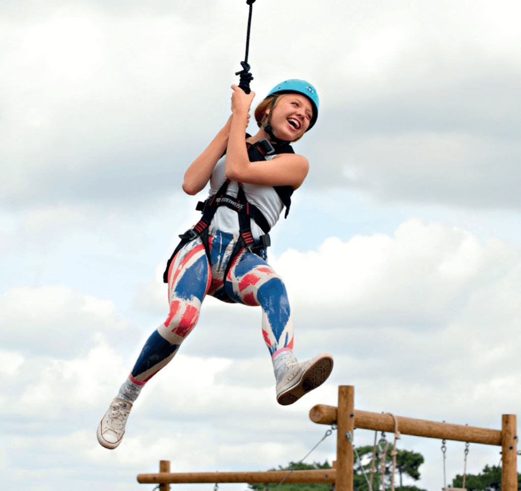 A school girl on a zip wire at a Kingswood centre