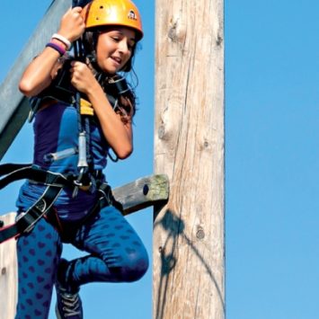 A school girl on a zip wire at a Kingswood centre