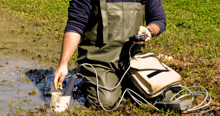 Man undertaking testing in a wet field, representing Green Careers Week