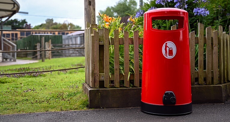 A red litter bin