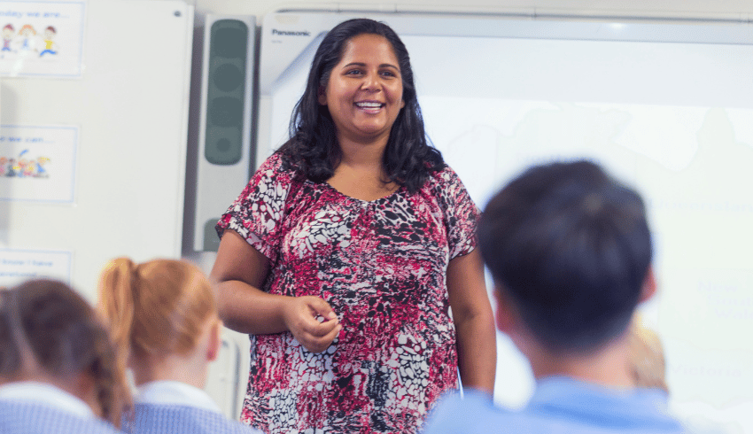 Teacher at front of class, representing scaffolding in education