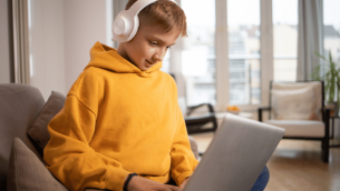Boy on laptop, representing alternative provision