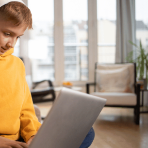 Boy on laptop, representing alternative provision