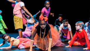 Students performing on a stage